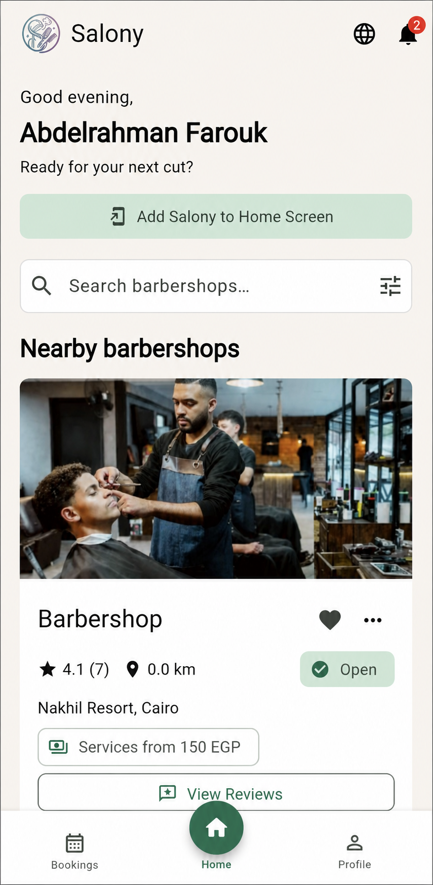 Salony customer discovery screen showing nearby barbershops and booking actions